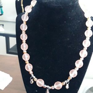 Fire glazed crystals hang from brushed glass